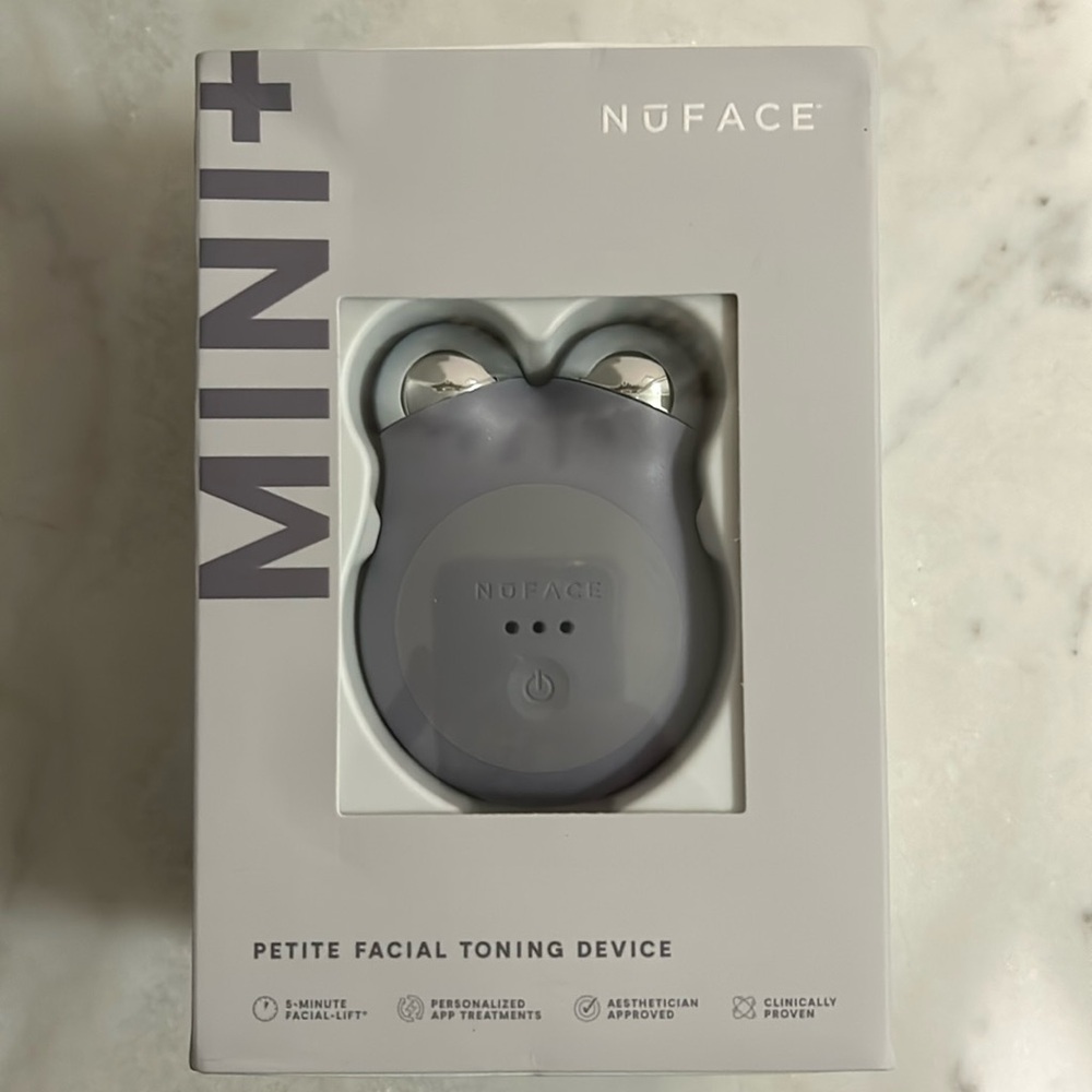 New in box never opened The gray Mini + Nuface face device for facial toning.